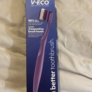 Purple Toothbrush with Replaceable Heads